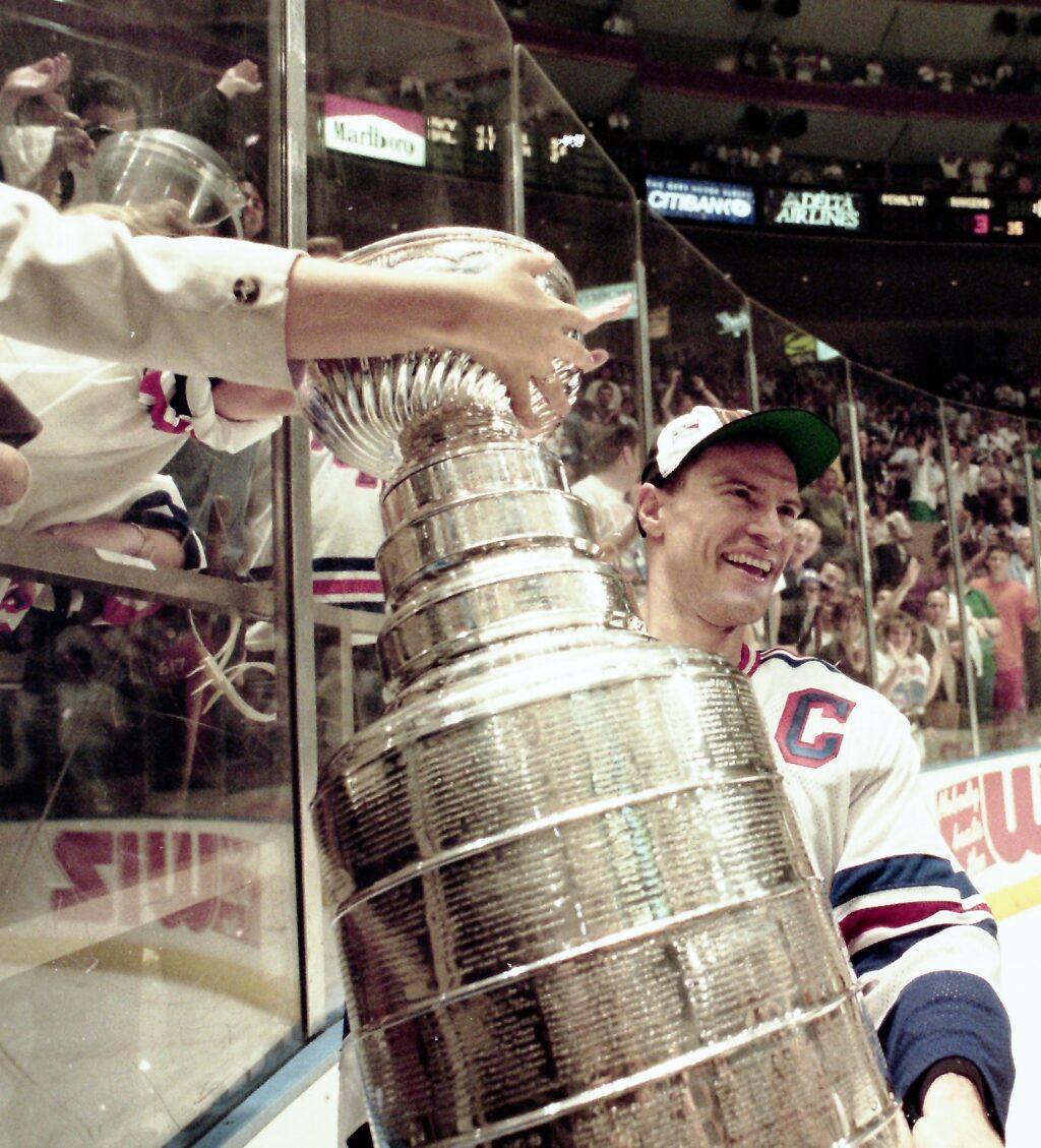 Mark Messier with the Stanley Cup at the glass, 1994