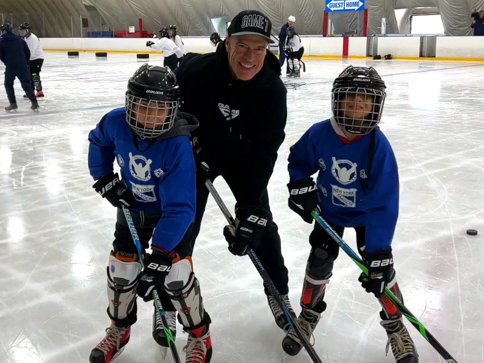 Mark Messier on the ice with two young North Park players